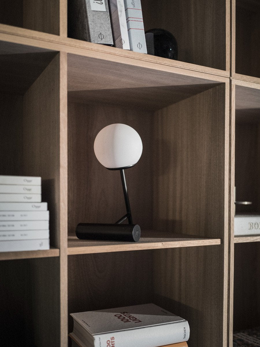 Phare Table Lamp by Audo styled on an oak bookshelf – In Dubai by WSPR