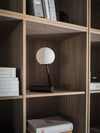 Phare Table Lamp by Audo styled on an oak bookshelf – In Dubai by WSPR