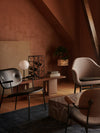 Umanoff Wine Rack by Audo styled in a warm-toned lounge with dark chairs – In Dubai by WSPR