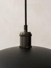 Hubert Pendant Ø45 by Audo, close-up of the bronzed brass fixture and black cord – In Dubai by WSPR