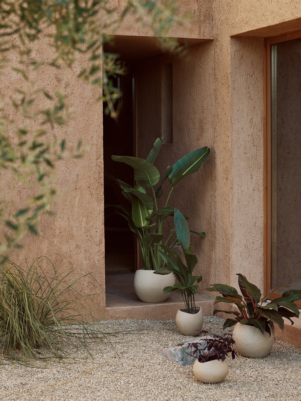 Plantas Planter by Audo styled in a sandy courtyard with green plants – In Dubai by WSPR