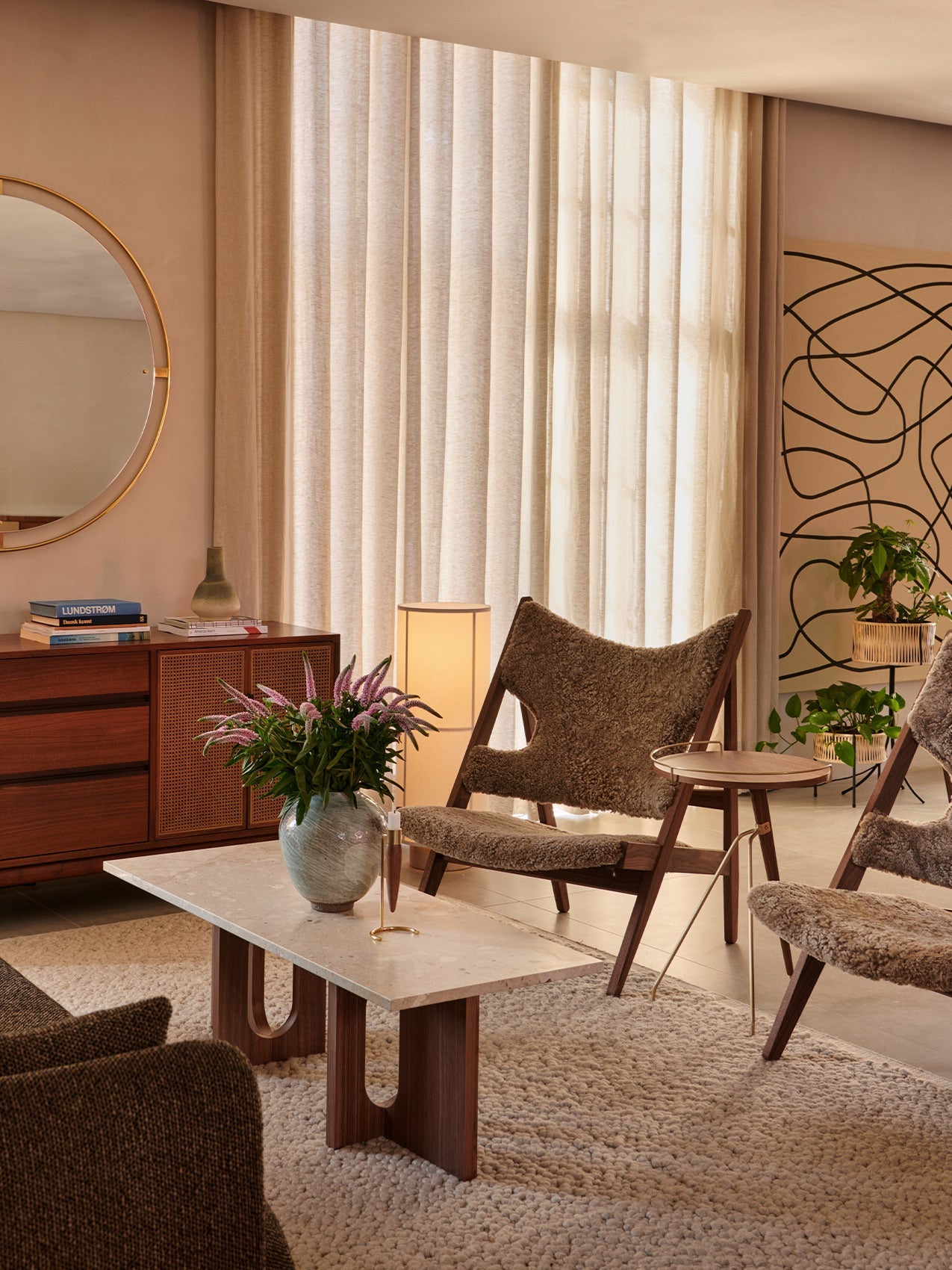 Umanoff Planter by Audo styled in a warm living room beside a lounge chair – In Dubai by WSPR