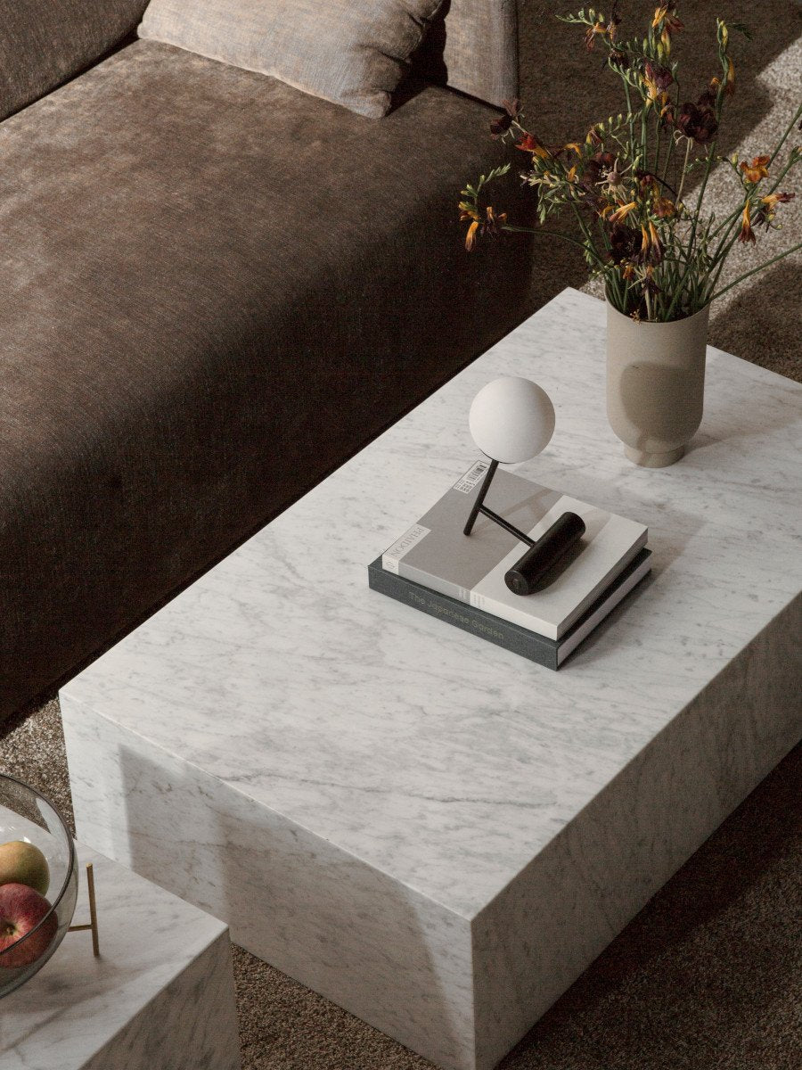 Phare Table Lamp by Audo styled on a marble coffee table beside a sofa – In Dubai by WSPR