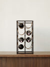 Umanoff Wine Rack by Audo holding wine bottles on a wooden sideboard – In Dubai by WSPR