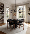 Arc Dining Table, Ø120 by 101 Copenhagen in Coffee Black Oak in a styled interior, view 2 – In Dubai by WSPR