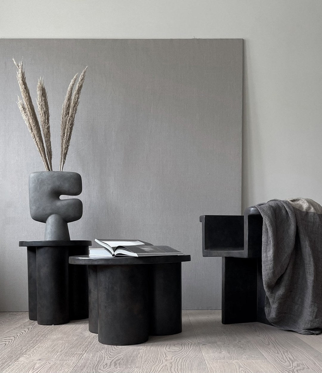 Big Foot Table, Tall by 101 Copenhagen in Coffee in a styled interior, view 3 – In Dubai by WSPR