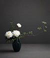 Bloom Vase Slim, Mini by 101 Copenhagen in Dark Green in a styled interior, view 2 – In Dubai by WSPR