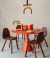 Body Chair by Sancal at a red dining table – In Dubai by WSPR
