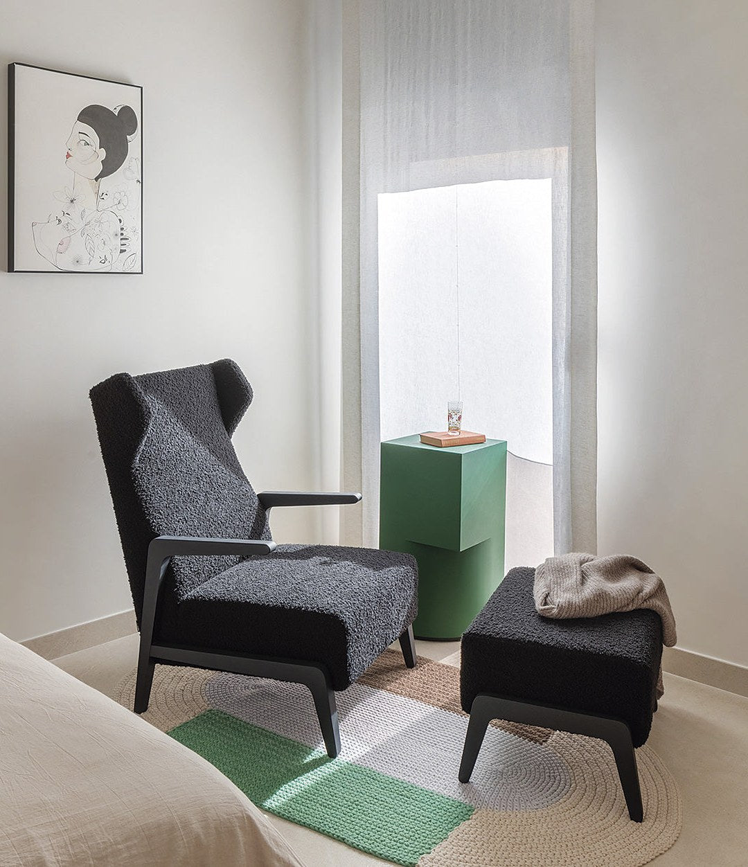 Boomerang Chill Wing Armchair by Sancal in charcoal bouclé with black stained ash and pouf – In Dubai by WSPR