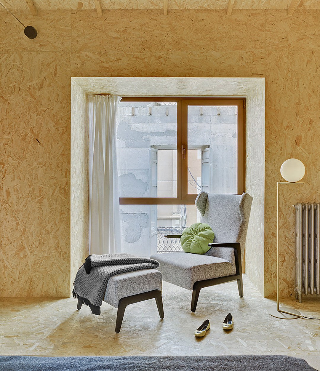 Boomerang Chill Wing Armchair by Sancal in light grey in a bedroom – In Dubai by WSPR