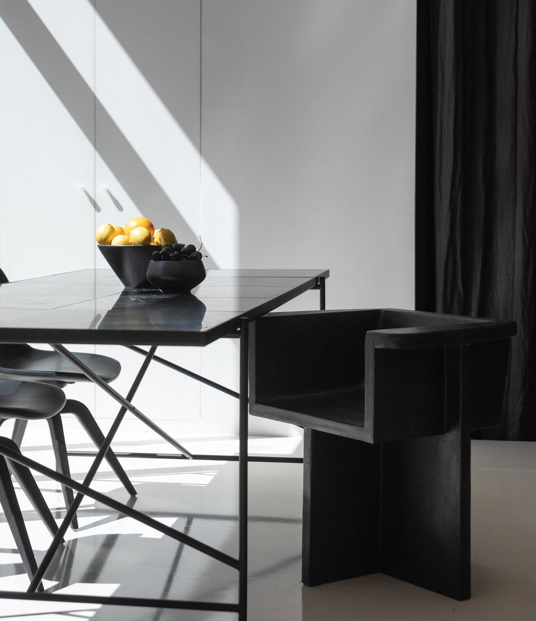 Brutus Dining Chair by 101 Copenhagen in Coffee in a styled interior – In Dubai by WSPR