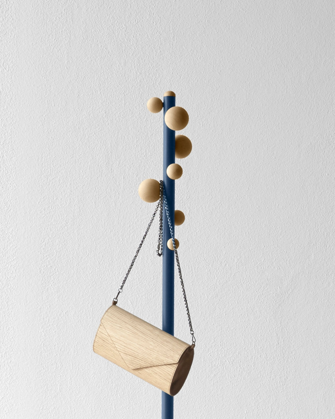 Bubble Coat Rack by Miniforms in blue lacquer with natural beech spheres and a wooden bag – In Dubai by WSPR