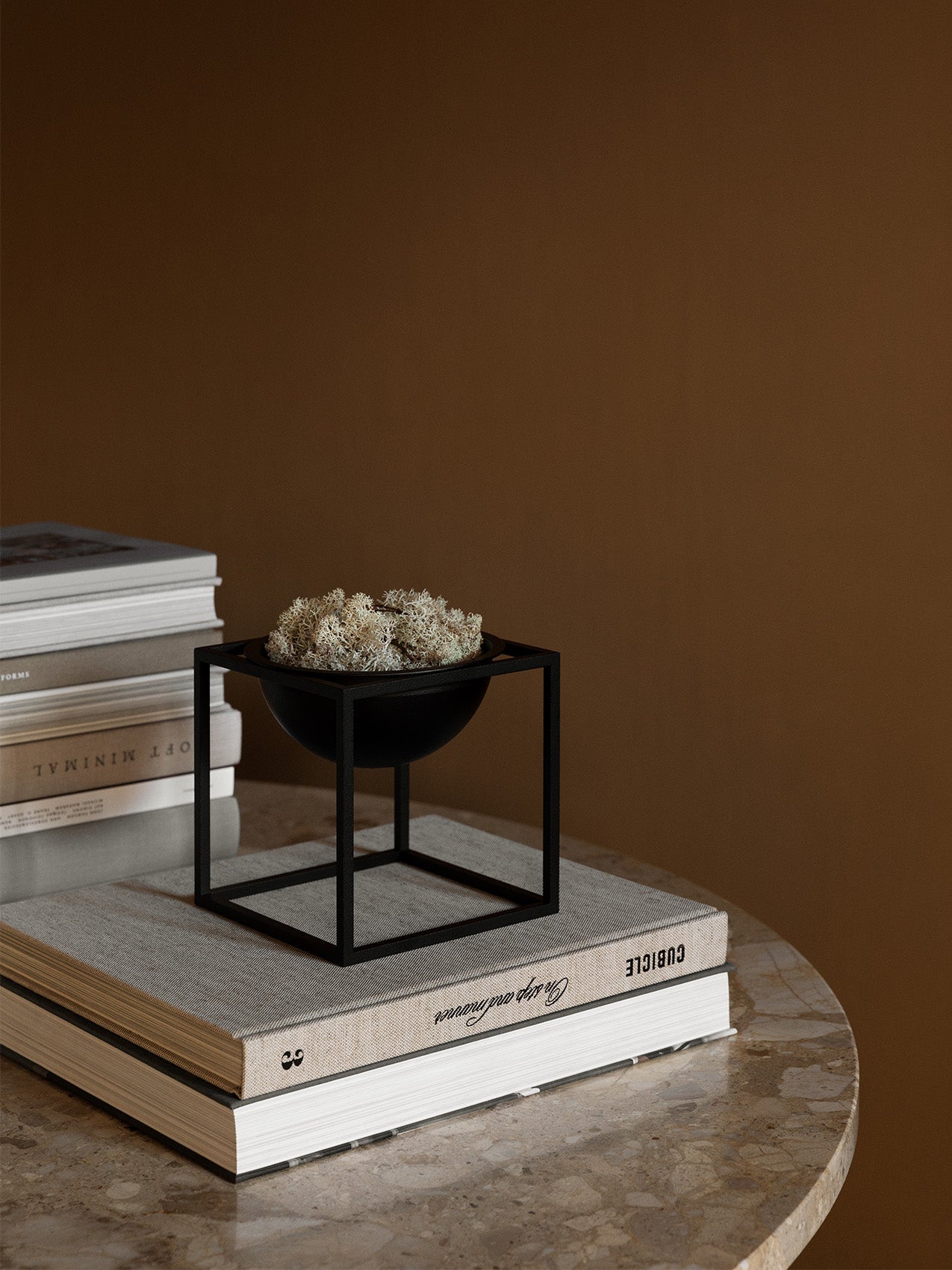 Kubus Bowl by Audo styled on a stack of books on a marble side table – In Dubai by WSPR