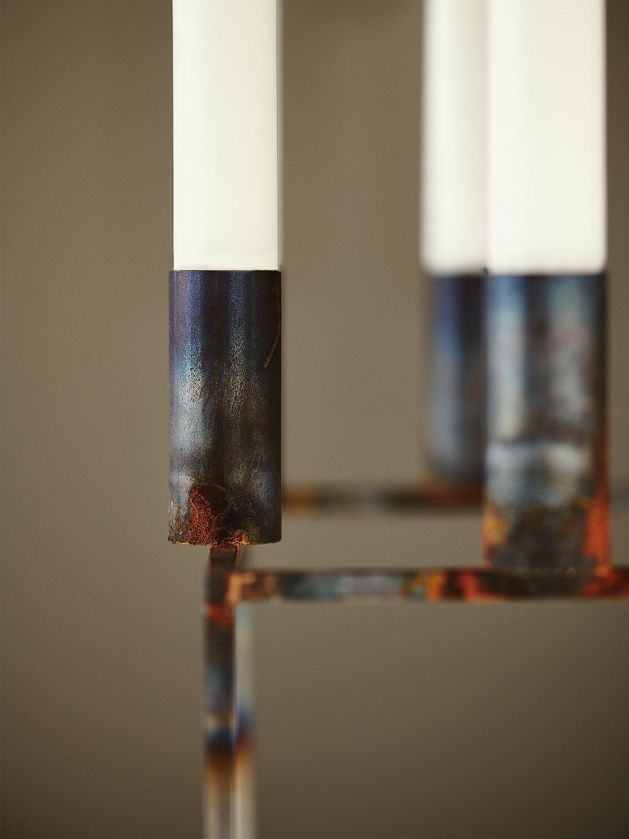 Kubus 8 Raw, Limited Edition by Audo styled with tapers on a marble shelf – In Dubai by WSPR