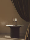 Kubus 8 Raw, Limited Edition by Audo styled on a dark table against a warm brown wall – In Dubai by WSPR