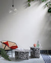 Chap Coffee Table by Miniforms in Palladio Moro marble, styled beside a lounge chair with a glass pendant – In Dubai by WSPR