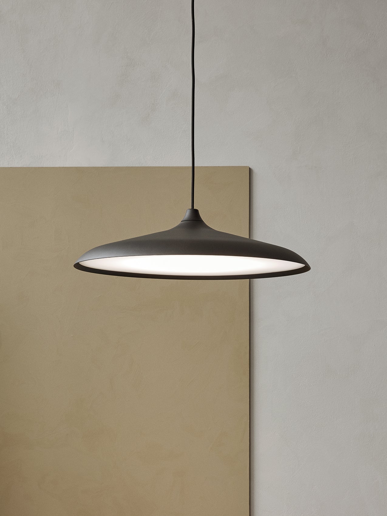 Circular Pendant by Audo styled against a soft neutral wall – In Dubai by WSPR