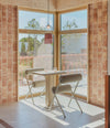Cita Bistro Table by Sancal with chairs by a window – In Dubai by WSPR