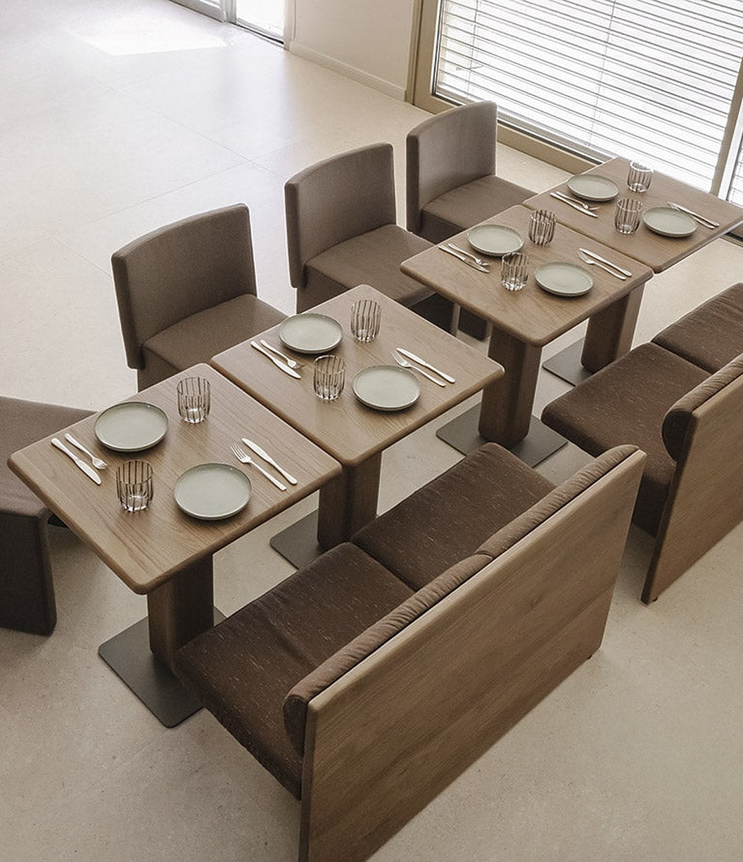 Cita Chair by Sancal in brown around restaurant tables – In Dubai by WSPR