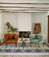 Click Armchair by Sancal in rust and green in a living room – In Dubai by WSPR