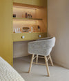 Collar Chair by Sancal in grey bouclé at a dressing table – In Dubai by WSPR