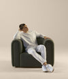 Core Armchair by Sancal in dark green, relaxed – In Dubai by WSPR