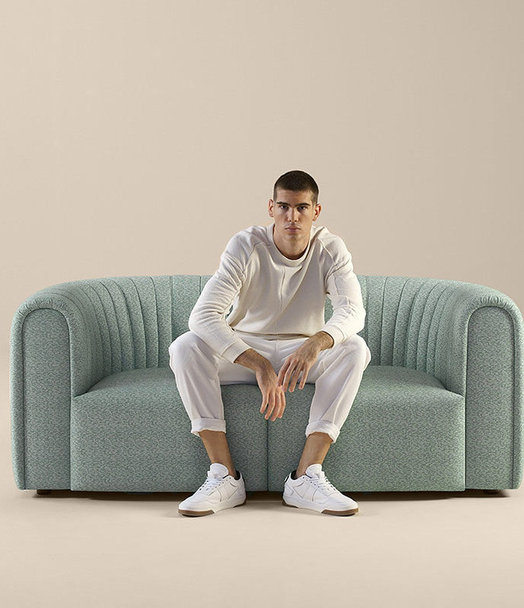 Core Sofa by Sancal two-seater in sage, seated – In Dubai by WSPR