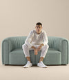 Core Sofa by Sancal two-seater in sage, seated – In Dubai by WSPR