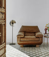 DB Armchair by Sancal in tan leather by a doorway – In Dubai by WSPR