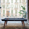 Diagonal Pool Table by RS Barcelona in Jet Black by a window onto a Barcelona street – In Dubai by WSPR