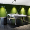 Diagonal Pool Table by RS Barcelona in Traffic White against a green wall – In Dubai by WSPR