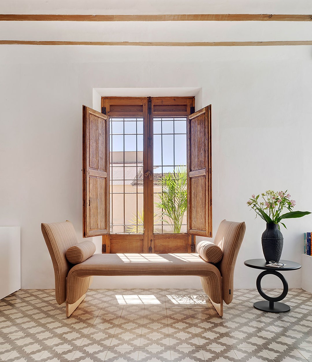 Diwan Bench by Sancal divan with arms in tan by a window – In Dubai by WSPR
