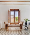 Diwan Bench by Sancal divan with arms in tan by a window – In Dubai by WSPR