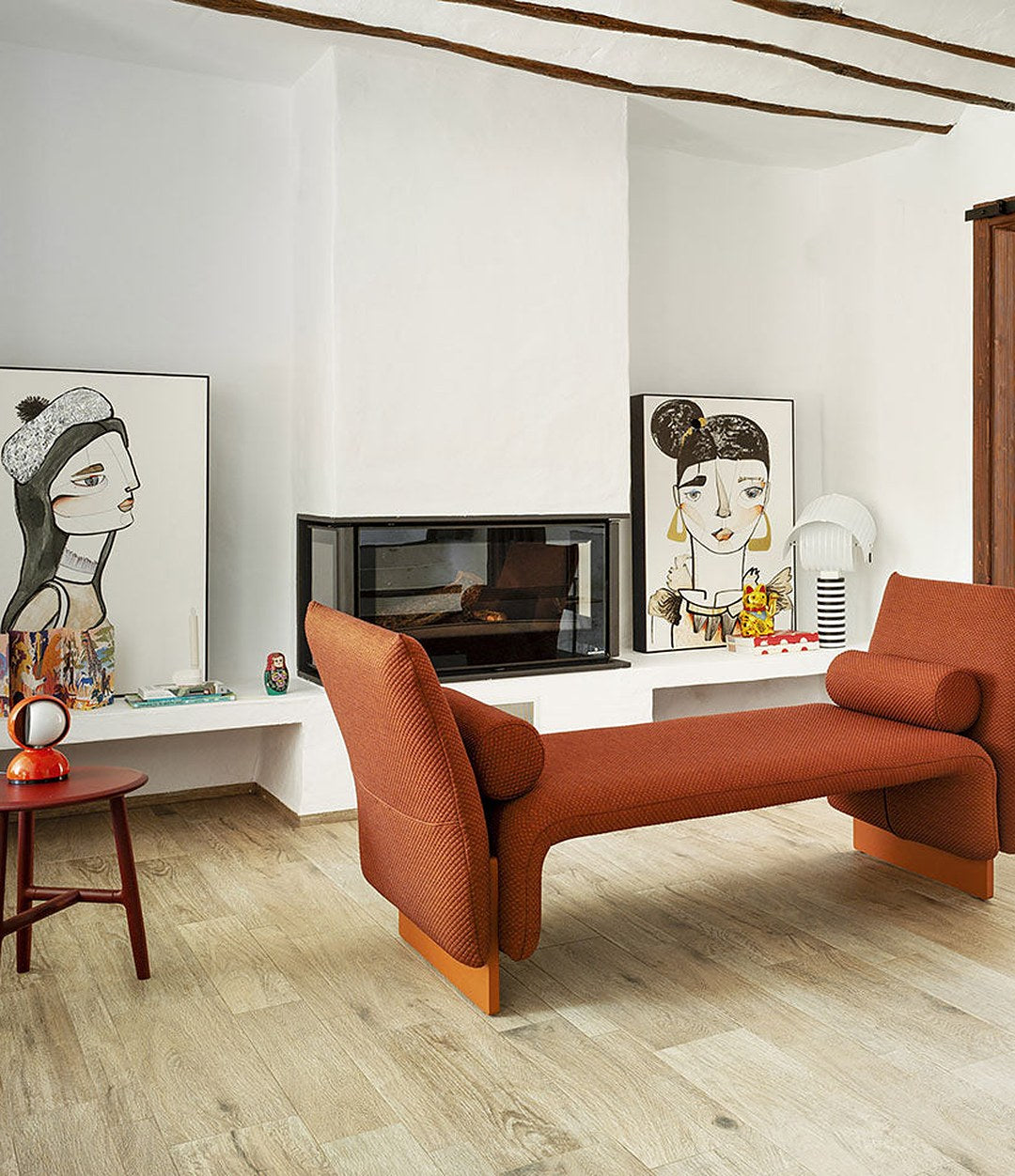 Diwan Bench by Sancal divan with arms by a fireplace – In Dubai by WSPR