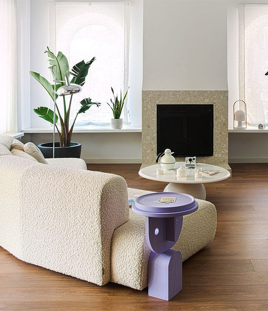 Duo Maxi Modular Sofa by Sancal curved sofa in white bouclé by a fireplace – In Dubai by WSPR