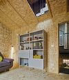 Estante Acoustic Shelving by Sancal tall unit in a loft – In Dubai by WSPR