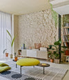 Estante Acoustic Shelving by Sancal sideboard in a living room with a green pouf – In Dubai by WSPR