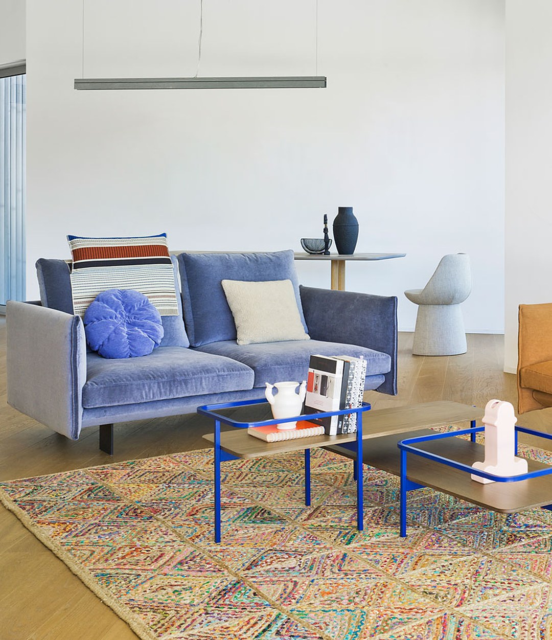 Estola Headrest Cushion by Sancal on blue and tan sofas in a living room – In Dubai by WSPR