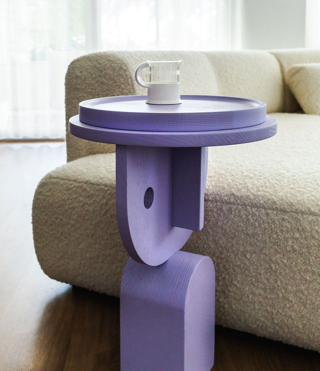 Faces Side Table by Sancal in lilac beside a bouclé sofa – In Dubai by WSPR