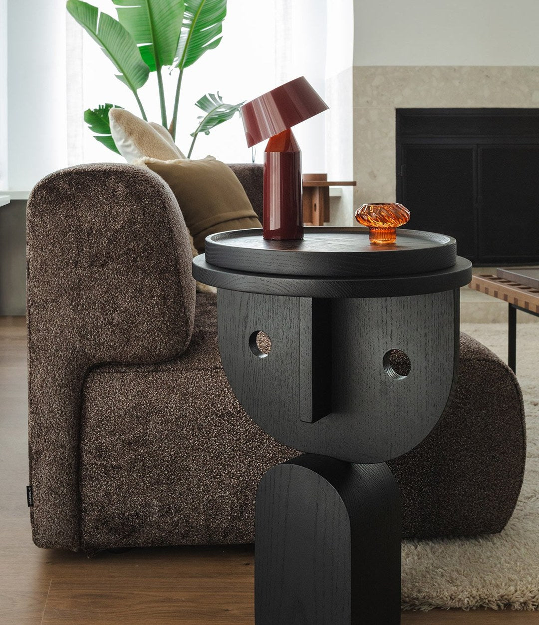 Faces Side Table by Sancal in black with a table lamp – In Dubai by WSPR