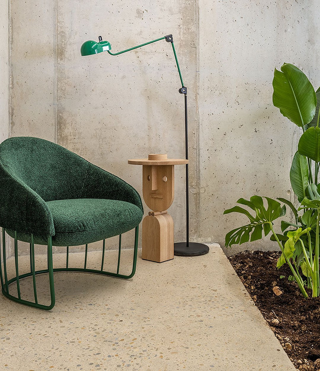 Faces Side Table by Sancal in natural oak with a green armchair – In Dubai by WSPR