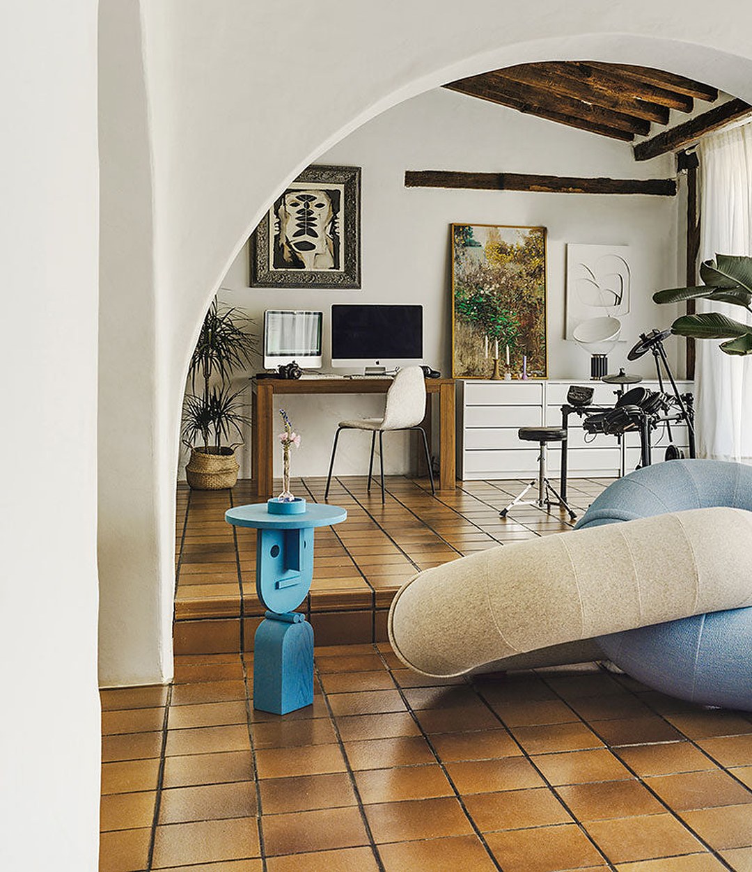 Faces Side Table by Sancal in blue under an arch – In Dubai by WSPR