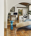 Faces Side Table by Sancal in blue under an arch – In Dubai by WSPR