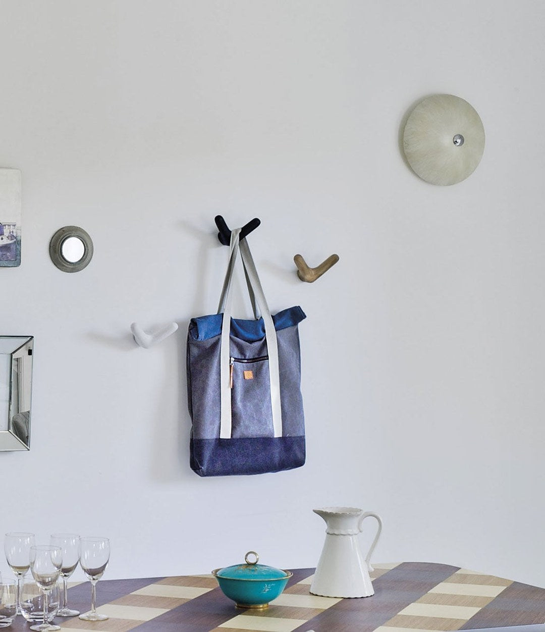 Float Wall Hook by Sancal hooks with a bag in a dining room – In Dubai by WSPR