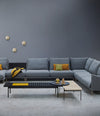 Interchange Bench by Sancal in black as a coffee table beside a sofa – In Dubai by WSPR