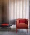 Interchange Bench by Sancal in black with a red seat beside an armchair – In Dubai by WSPR