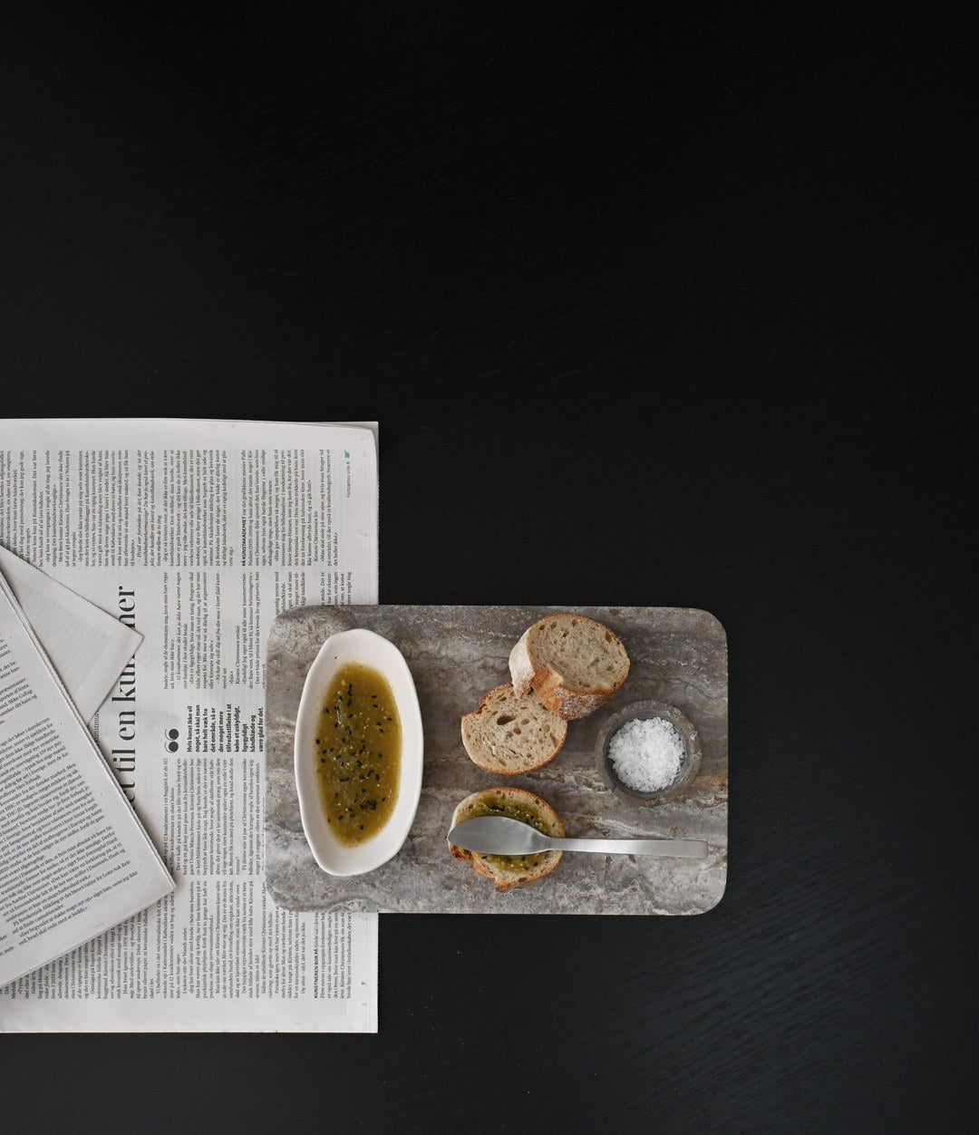 Kogei Butter Knife by 101 Copenhagen in Brushed Steel in a styled interior, view 2 – In Dubai by WSPR