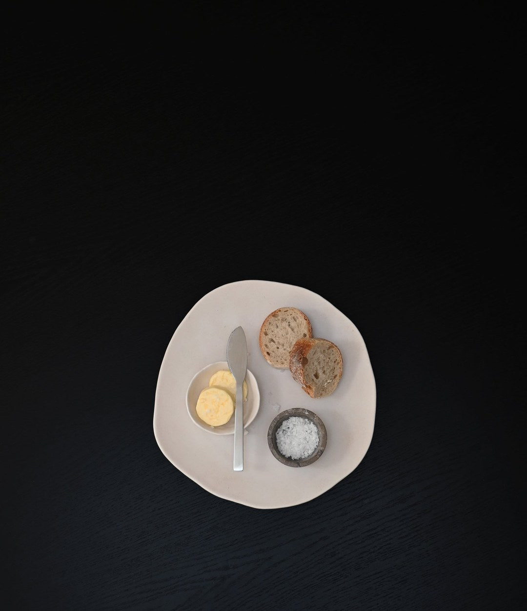 Kogei Butter Knife by 101 Copenhagen in Brushed Steel in a styled interior, view 3 – In Dubai by WSPR