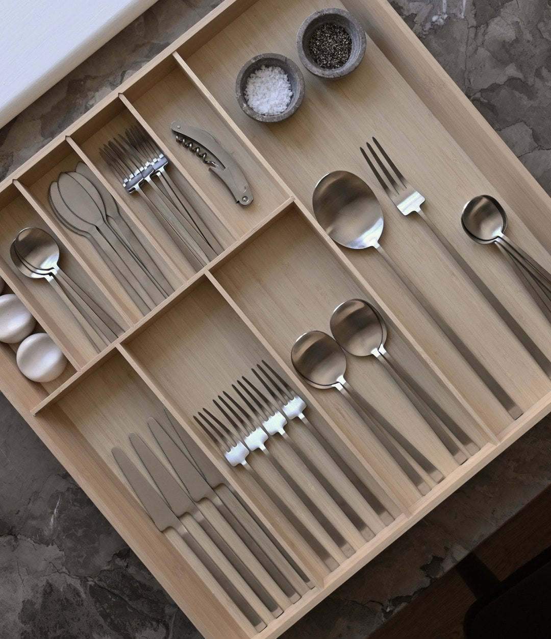 Kogei Dessert Fork by 101 Copenhagen in Brushed Steel in a styled interior, view 3 – In Dubai by WSPR
