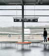 Konoha Bench by Sancal benches at an airport window – In Dubai by WSPR